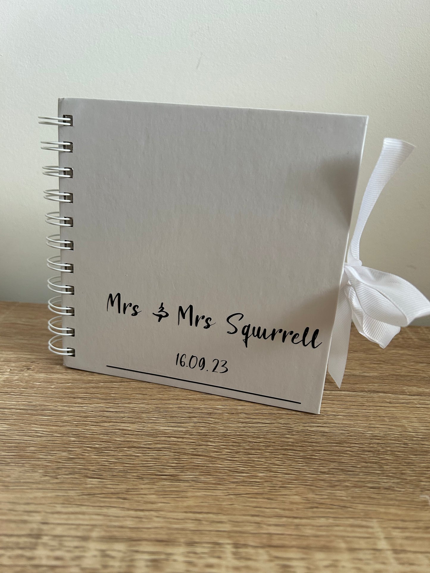 Glossy, wire bound guestbook.