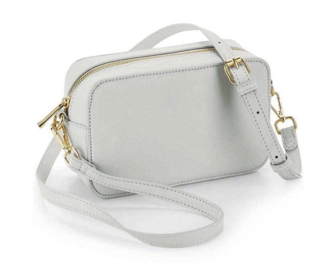 Monogrammed box cross body bag.
