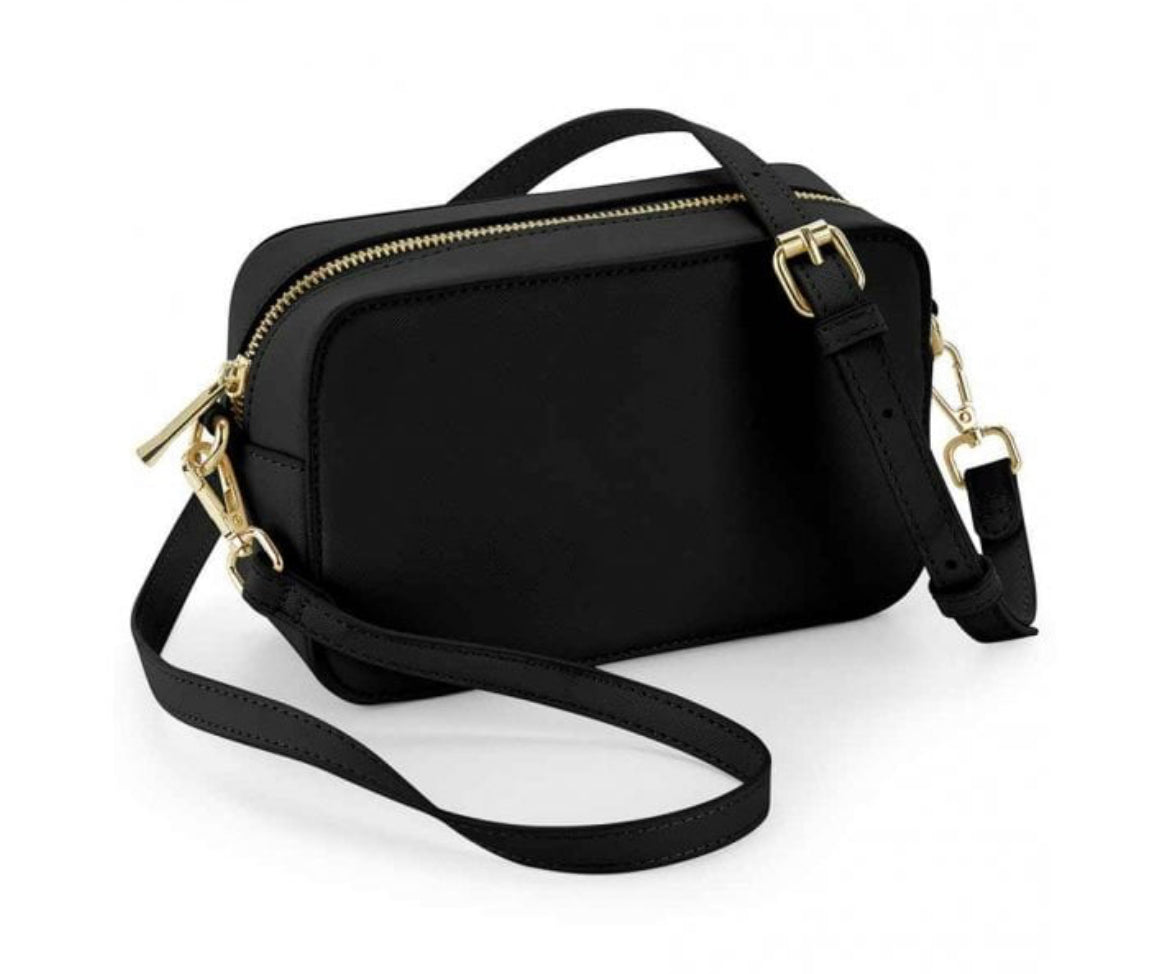 Monogrammed box cross body bag.