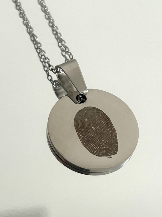 Engraved fingerprint necklace.