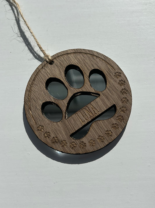 Custom engraved mirrored paw decoration.